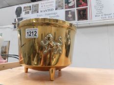 An early 19th century brass jam pan with lion motif and '1529' on rear