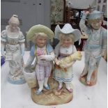 A 19th century continental bisque figure group and 2 other bisque figures