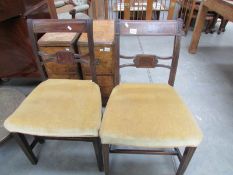 A pair of antique mahogany inlaid chairs