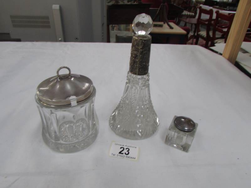 A silver topped scent bottle,