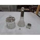A silver topped scent bottle,