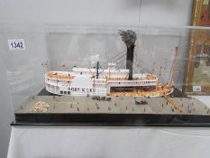 A cased model of the Robert E Lee paddle steamer
