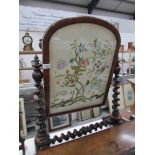 A mahogany toilet mirror inset with tapestry