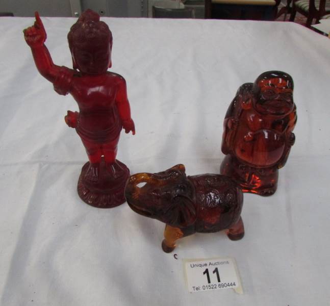 2 oriental figures and an elephant