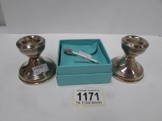 A pair of silver candlesticks, hallmarked Birmingham 1966/67 and a Tiffany & Co.