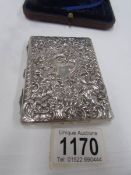 A cased silver card case,