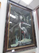 A large framed and glazed oriental embroidery of a stork