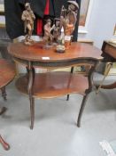 A mahogany 2 tier table with shell inlay