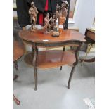 A mahogany 2 tier table with shell inlay