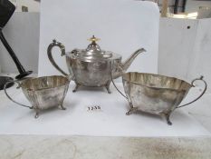 A three piece silver tea set,