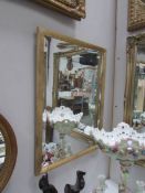 A gilt framed bevel edged mirror