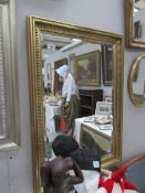 A gilt framed bevel edged mirror