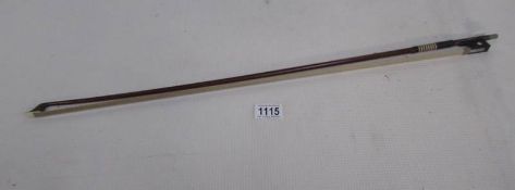 A violin bow (signed at finger grip)