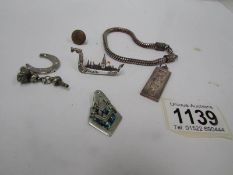 A silver ingot and other pieces (some silver)