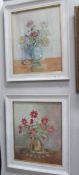 A pair of framed and glazed still life floral studies,