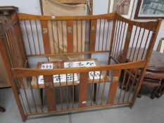 A vintage babies cot with transfers