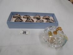 A set of 8 silver plated napkin rings and a Killarney crystal lidded bowl with 24ct gold detail