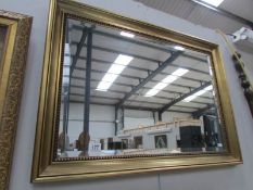 A gilt framed bevel edged mirror