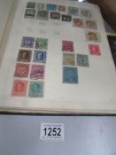 An album of world stamps from late 19th to early 20th century