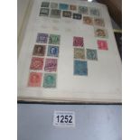 An album of world stamps from late 19th to early 20th century