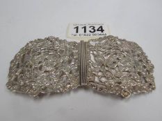 A Victorian silver buckle dated Birmingham 1898 with frolicking cherubs among grape vines