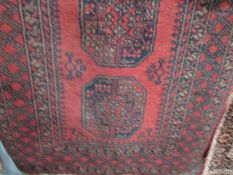 A red patterned Arabian rug