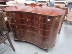 A good quality kidney shaped mahogany 6 drawer chest plus 1 secret drawer