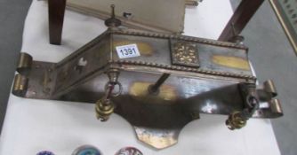 An Edwardian brass pelmet wall light