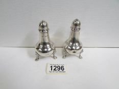 A pair of silver pepperettes,