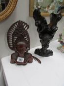 2 carved African heads,