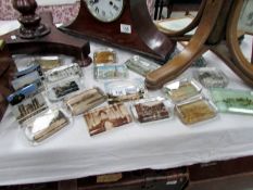 A collection of 10 glass paperweights of various tourist places