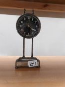 An unusual metal cased mantel clock