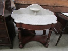 A mahogany marble topped Duchy wash stand