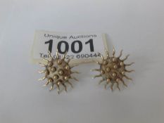 A pair of gold and silver 'sunburst' earrings