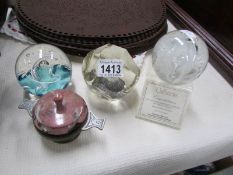 2 paperweights and a stone bowl in metal stand