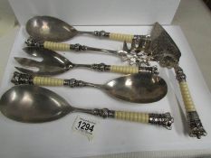 A set of 6 serving cutlery surmounted with crown/coronet