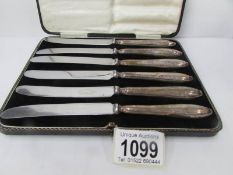 A cased set of 6 silver handled butter knives