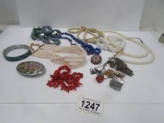 A mixed lot of costume jewellery including 'stick coral' necklace and glass necklace