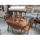 An Ercol style table and 4 chairs