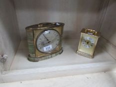 A carriage clock and one other