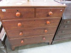 An oak 2 over 3 chest of drawers