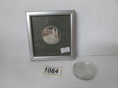 A framed Southwell MInster commemorative coin and a 2006 Gibralter Queen Elizabeth 80th birthday