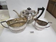 A 3 piece silver tea set comprising teapot hall marked Sheffiled 1896.