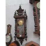 A mahogany wall clock