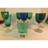 7 Victorian green glass goblets and a blue glass goblet