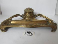 An art nouveau brass inkstand