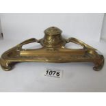 An art nouveau brass inkstand