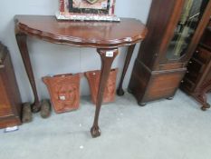 An Edwardian D end side table with Queen Anne style ball and claw feet