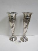 A pair of decorative silver vases, maker W C, London 1921,