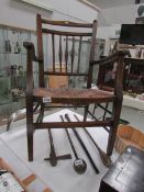 A 19th century carver chair with string seat